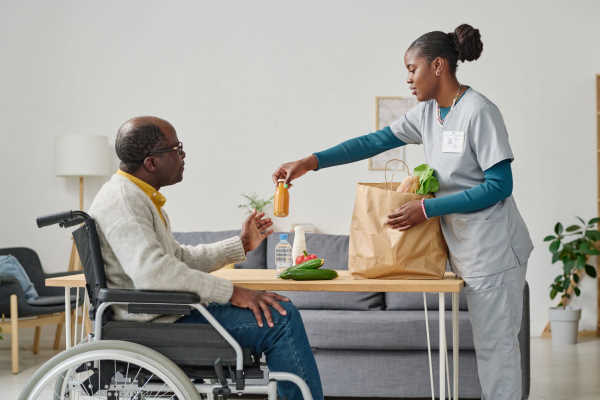Caregiver preparing a nutritious home-cooked meal for a senior