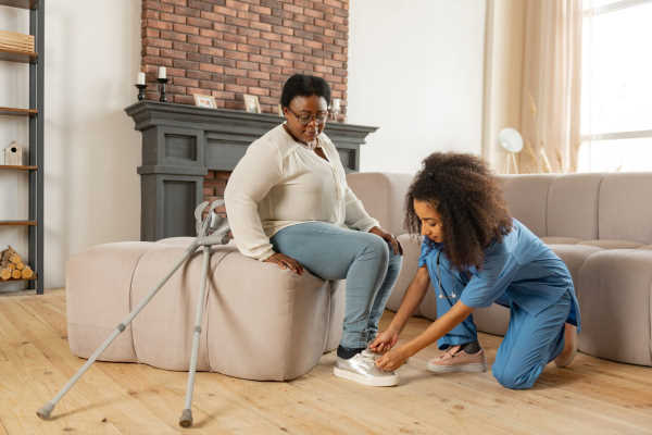 Daley Hope caregiver assisting a senior with personal care at home